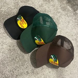 Three tracker bass pro shop hats.
